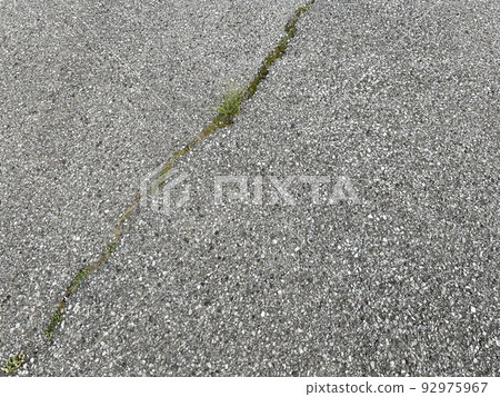 A cracked asphalt road 92975967