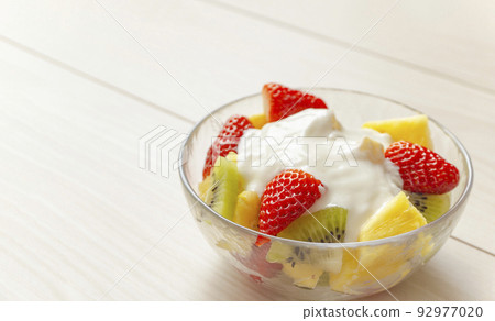 Yogurt and fruit in a glass bowl. Yogurt, fruit, vitamins, nutrients, breakfast, dessert, etc. 92977020