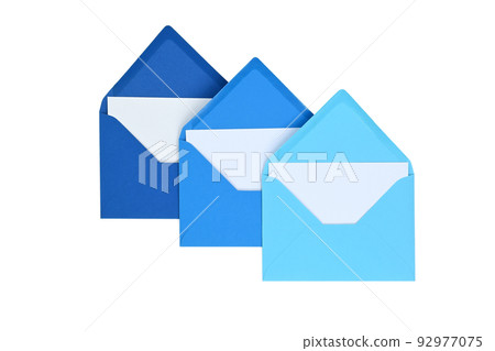 Envelopes of blue hues with blank white card 92977075