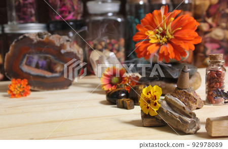Agatized Coral With Quartz Crystals and Flowers on Meditation Table Agatized Coral With Quartz Crystals and Flowers on Meditation Table 92978089