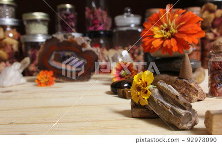 Agatized Coral With Quartz Crystals and Flowers on Meditation Table Agatized Coral With Quartz Crystals and Flowers on Meditation Table 92978090