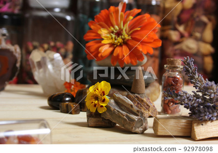 Flowers and Incense Cone With Palo Santo Sticks on Meditation Table Flowers and Incense Cone With Palo Santo Sticks on Meditation Table 92978098