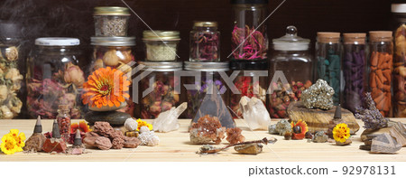 Meditation Altar With Rock Crystals and Flowers. Jars of Herbs in Background Meditation Altar With Rock Crystals and Flowers. Jars of Herbs in Background 92978131