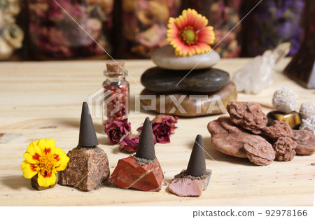 Incense Cones and Desert Rose Rocks on Meditation Table Incense Cones and Desert Rose Rocks on Meditation Table 92978166