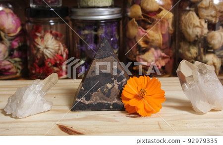 Quartz Crystals and Stone Pyramid With Flower. Relaxation and Meditation Decor 92979335