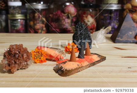 Aragonite Crystal With Incense and Stone Pyramid on Meditation Altar 92979338