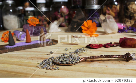 Dried Lavender and Rose Petals on Table With Incense Cones and Crystals 92979352