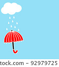 Red umbrella, clouds and rain in the blue sky background 92979725