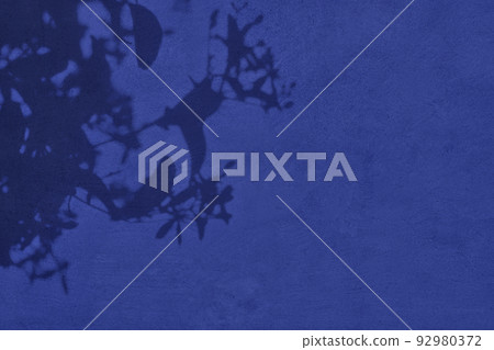 Shadow of leaves on purple concrete wall texture background Shadow of leaves on purple concrete wall texture background 92980372