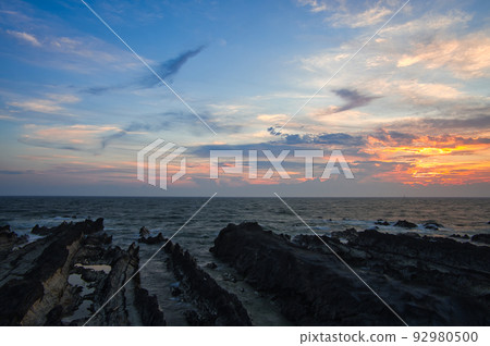 Arasaki Coast at dusk Sunset sky and beach scenery 92980500
