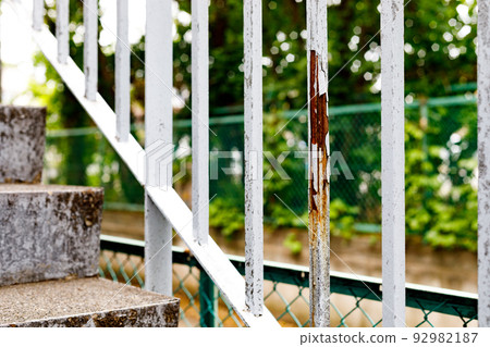Outdoor stair handrail painting work 92982187