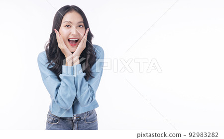 Surprise excited asian woman casual screaming mouth wow promotion discount product holding hands Surprise excited asian woman casual screaming mouth wow promotion discount product holding hands 92983282