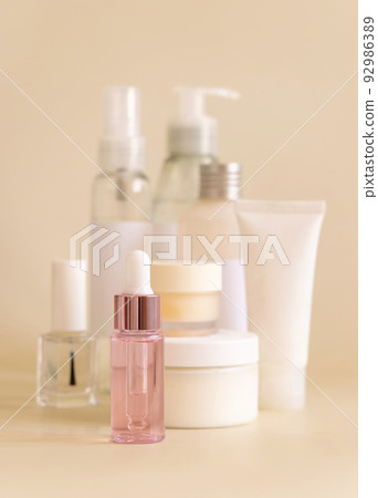 Natural cosmetic jarsand bottles and skin care accesories on light yellow close up 92986389