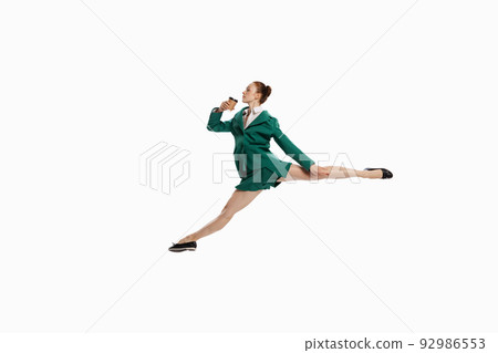 Stylish young woman in business style outfit in motion isolated over white background. Emotions, finance, aspiration, business, job concept. Stylish young woman in business style outfit in motion isolated over white background. Emotions, finance, aspiration, business, job concept. 92986553