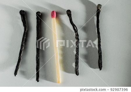 All the matches burned except for one. Danger of smoke, fire.Pink match heads 92987396