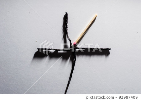 Burnt matches on a white background Burnt matches on a white background 92987409