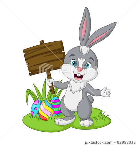 Cartoon little bunny holding a blank plank sign in the grass Cartoon little bunny holding a blank plank sign in the grass 92988038