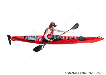 Aerial view of young woman in red canoe, kayak with a life vest and a paddle isolated on white background. Concept of sport, nature, travel, active lifestyle Aerial view of young woman in red canoe, kayak with a life vest and a paddle isolated on white background. Concept of sport, nature, travel, active lifestyle 92988573