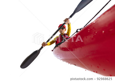 Beginner kayaker in red canoe, kayak with a life vest and a paddle isolated on white background. Concept of sport, nature, travel, active lifestyle Beginner kayaker in red canoe, kayak with a life vest and a paddle isolated on white background. Concept of sport, nature, travel, active lifestyle 92988625