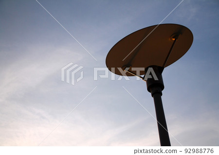 The design lamp and the empty blue sky 92988776