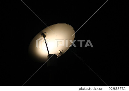 The shadows of the lights of a design lamp during the night The shadows of the lights of a design lamp during the night 92988781