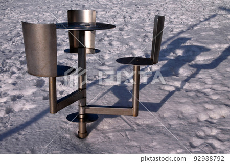 The iron high seats over the snow in a cold winter day The iron high seats over the snow in a cold winter day 92988792