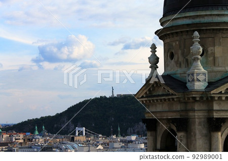 The far Liberty from the near Church of Saint Stephan in Budapest The far Liberty from the near Church of Saint Stephan in Budapest 92989001