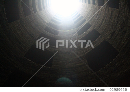View of half of the San Patrizio Well (Pozzo di San Patrizio) with the sun coming in 92989636