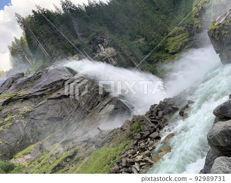 A close up picture of Krimml falls from the bottom 92989731