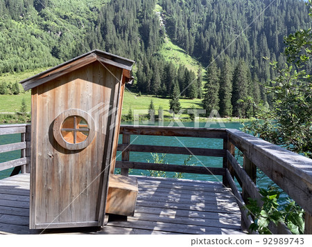 The hand made swing cabin with a spectacular view on the emerald lake 92989743