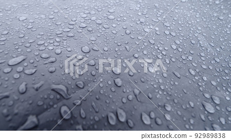 Raindrops on a blue tent close-up. Foggy morning in the Carpathians. Raindrops on a blue tent close-up. Foggy morning in the Carpathians. 92989838