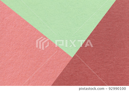 Texture of craft red, pink and green shade color paper background, macro. Structure of vintage abstract rose cardboard 92990100