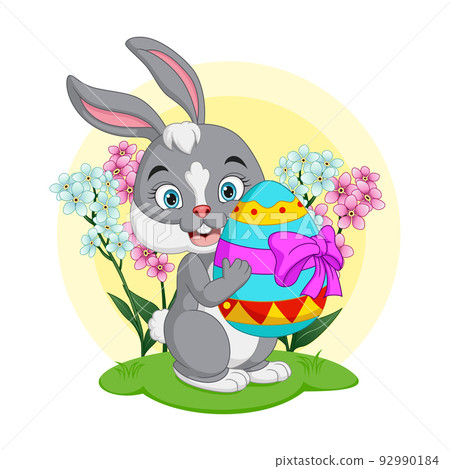 Cute little bunny holding an easter egg Cute little bunny holding an easter egg 92990184
