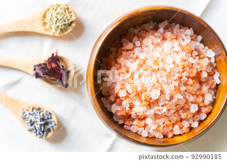 Himalayan rock salt (pink salt), aroma and dried herbs used for bath salts Himalayan rock salt (pink salt), aroma and dried herbs used for bath salts 92990185