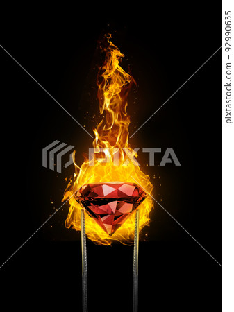 Shiny brilliant diamond red placed on fire on black background in diamond tweezers 92990635