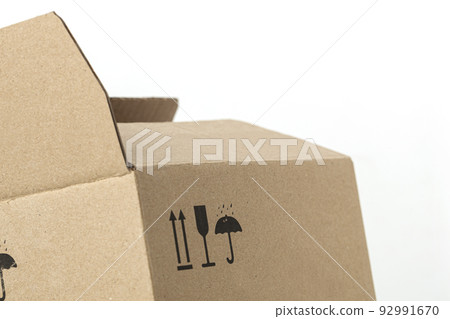 Closeup of a box made with recycled materials with recycling symbols Closeup of a box made with recycled materials with recycling symbols 92991670