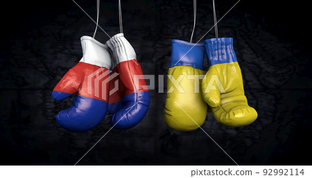 Hanging boxing gloves with the Russian and ukrainian flags illustrate the tensions between the two countries - 3d illustration 92992114