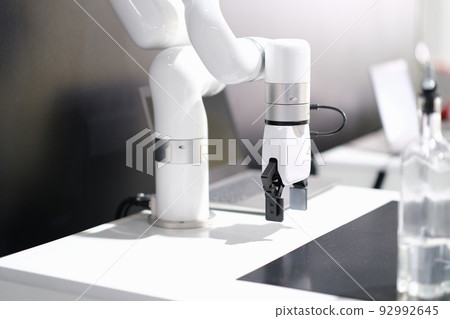Rendering of robotic arm working in factory 92992645