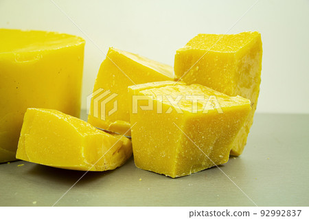 large pieces of natural beeswax, close-up, raw materials for candles. 92992837