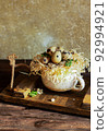 Quail eggs on a wooden table. Rustic style photography in daylight. 92994921
