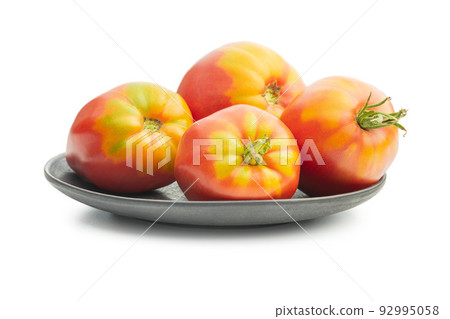 Bull heart tomatoes isolated on white background. 92995058