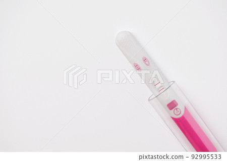 Positive pregnancy test with laboratory test tube. In vitro fertilization, artificial insemination and infertility treatment concept. Positive pregnancy test with laboratory test tube. In vitro fertilization, artificial insemination and infertility treatment concept. 92995533