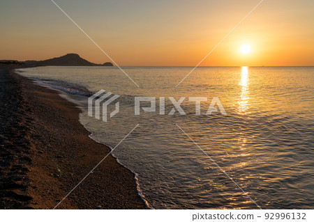 Afandou sea beach in Rhodes at sunrise of sunny summer day. 92996132