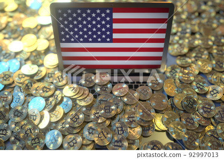 Flag of the USA on the laptop screen and many bitcoins. National cryptocurrency regulations and crypto mining concepts, 3d rendering Flag of the USA on the laptop screen and many bitcoins. National cryptocurrency regulations and crypto mining concepts, 3d rendering 92997013