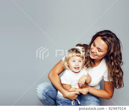 bright picture of hugging mother and daughter happy together, smiling stylish family. girls aloud close up bright picture of hugging mother and daughter happy together, smiling stylish family. girls aloud close up 92997014