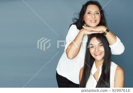 cute pretty teen daughter with mature mother hugging, fashion style brunette, lifestyle people concept close up cute pretty teen daughter with mature mother hugging, fashion style brunette, lifestyle people concept close up 92997018