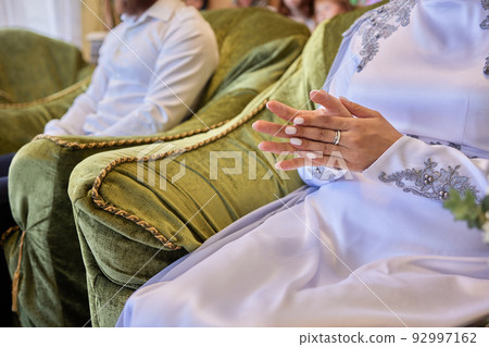 Bride and groom Asian Muslims marry in a beautiful red love theme. celebration nikah day. Bride and groom Asian Muslims marry in a beautiful red love theme. celebration nikah day. 92997162