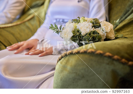 Bride and groom Asian Muslims marry in a beautiful red love theme. celebration nikah day. Bride and groom Asian Muslims marry in a beautiful red love theme. celebration nikah day. 92997163