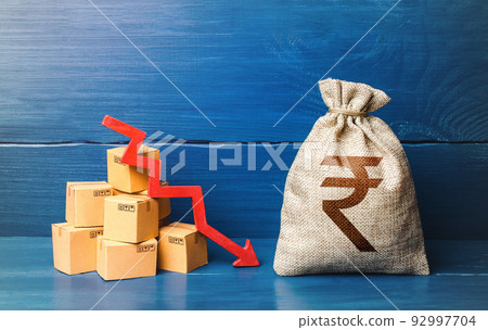 Indian rupee money bag with boxes and down arrow. Income decrease, slowdown and decline of economy. Low sales. Production decline. Reduced prices. Bad consumer sentiment and demand for goods. 92997704