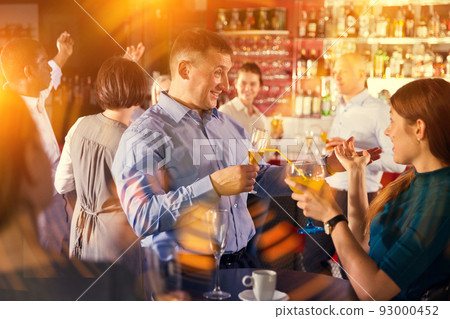 Businessman with female colleague fooling... - Stock Photo